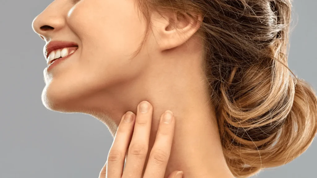 Woman receiving neck threading and waxing treatment for smooth, hair-free skin.